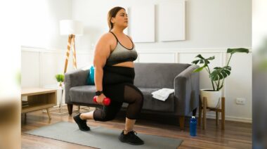 A person doing a dumbbell split squat.