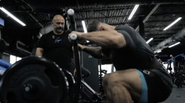 Chris Bumstead performing belt squats.