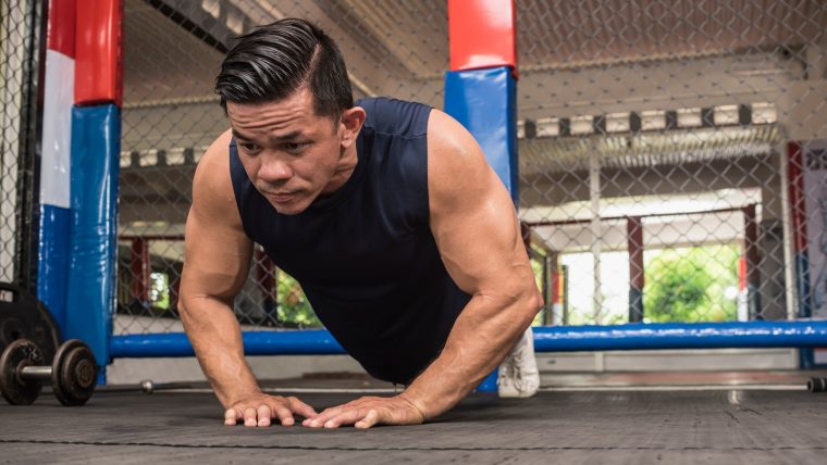 Man performing a close-grip push-up.