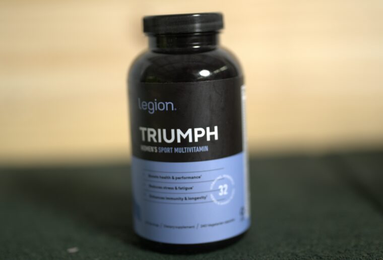 Legion Triumph Multivitamin for Women on a black surface