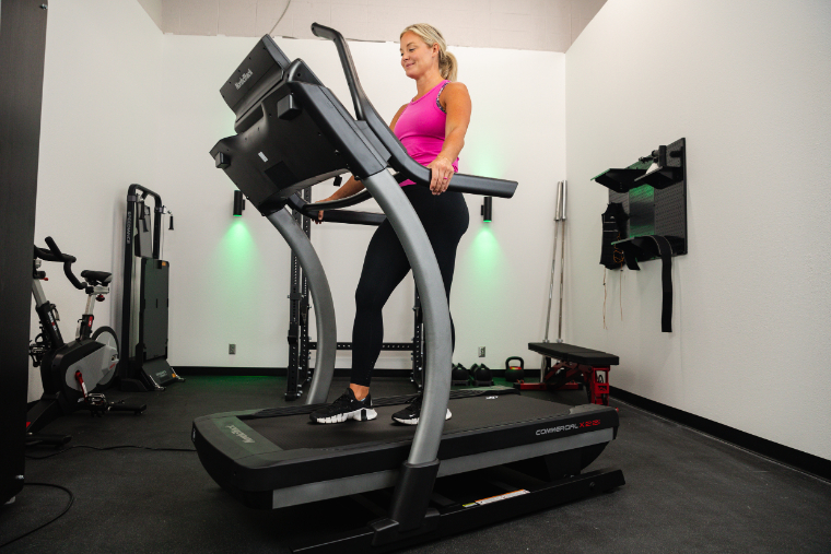 An athlete walking on the NordicTrack X22i treadmill