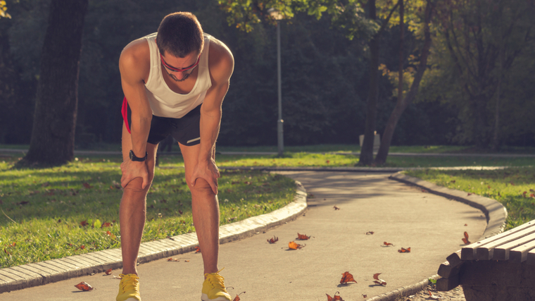 Runner stopping outdoors to rest